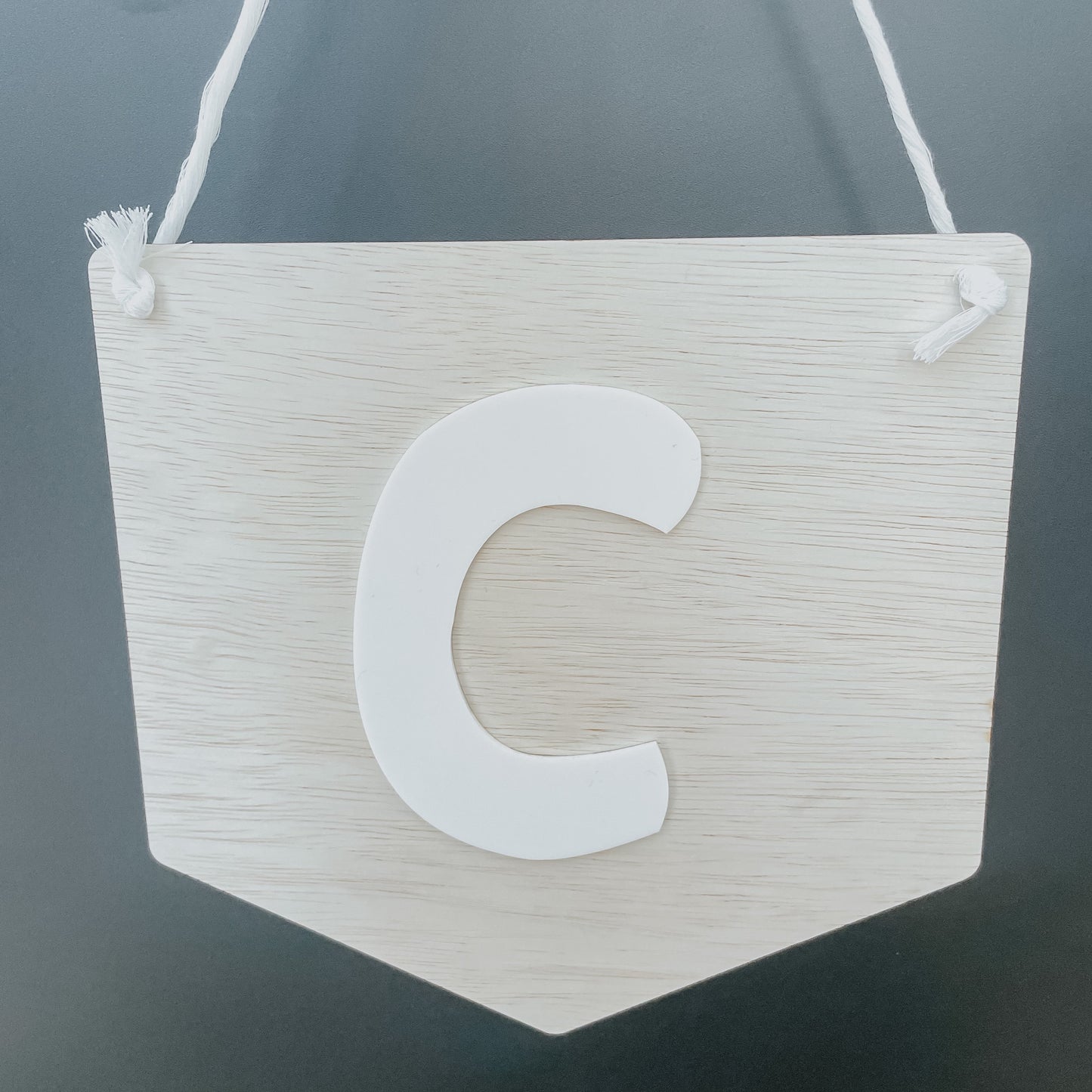 Initial hanging sign